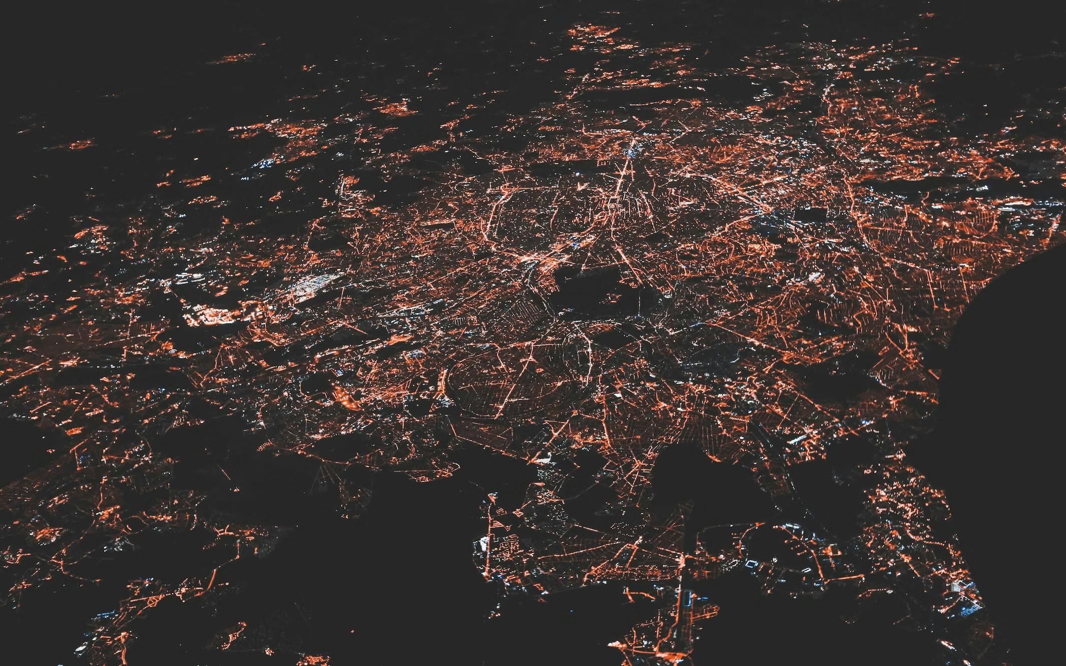 birdseye view of a lit up city at night